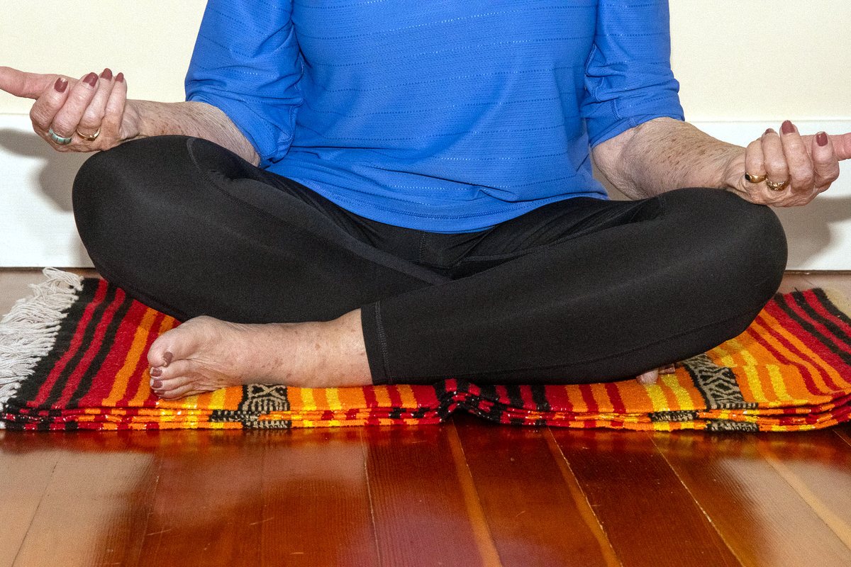 Seated hip-opening movement with open, resting hands