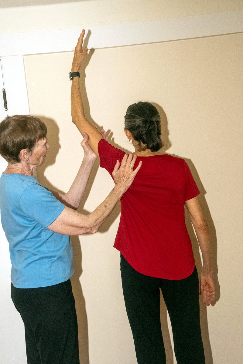 The arm floating upward as the trapezius lets go
